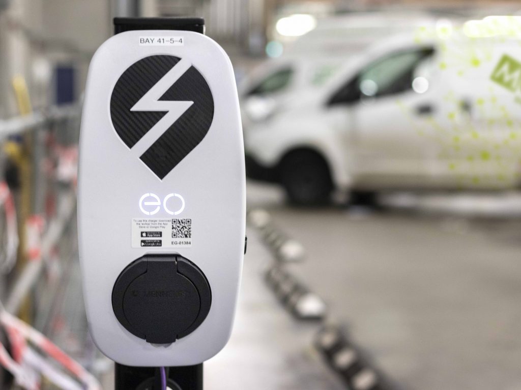 Electric vehicle charger with menzies van behind